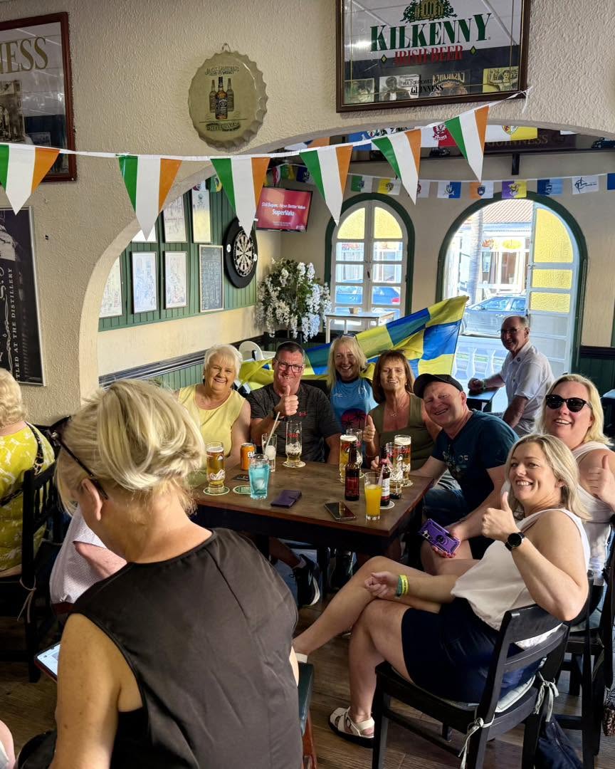 Groups enjoying drinks at the tables inside The Irish Table